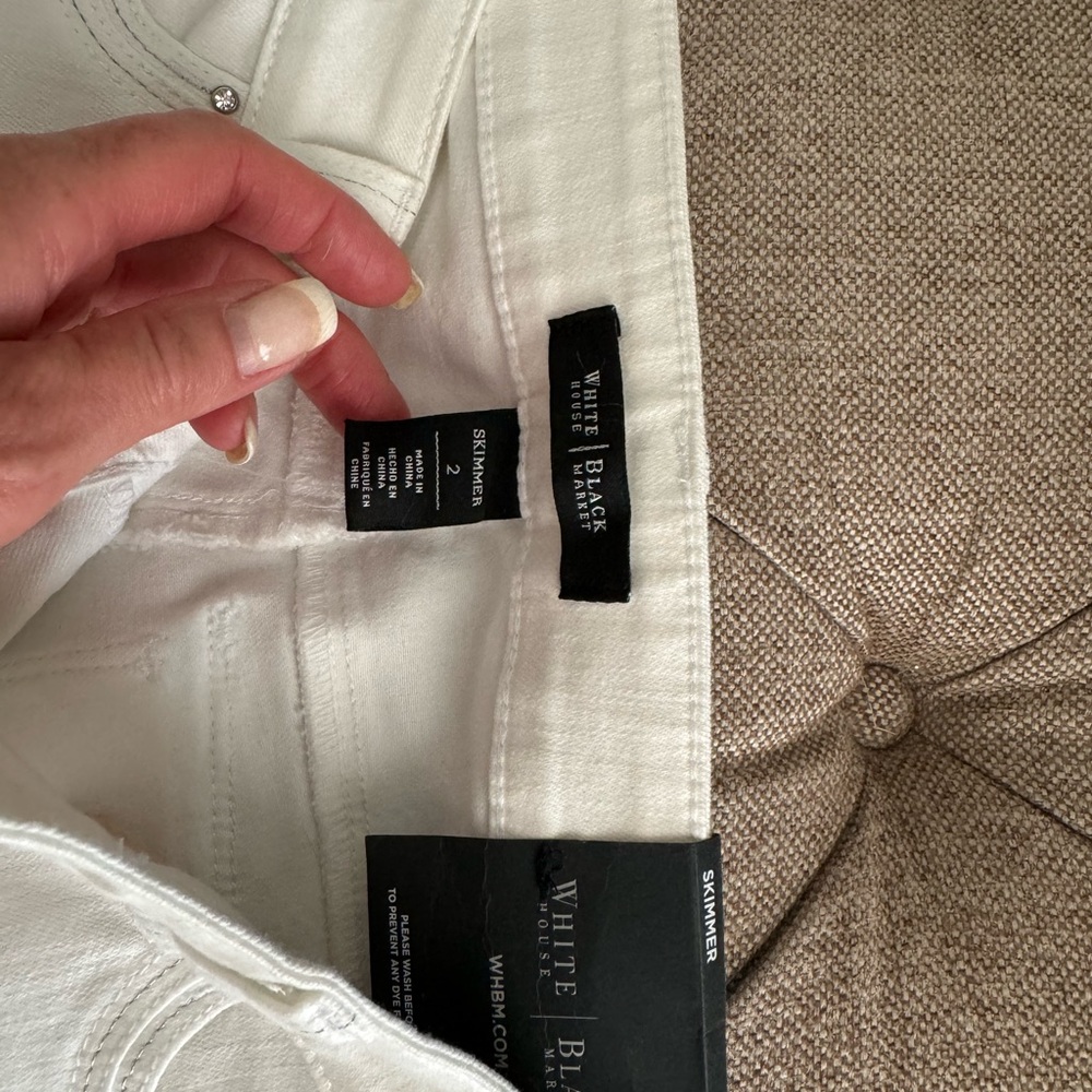 White House Black Market white crop jeans.